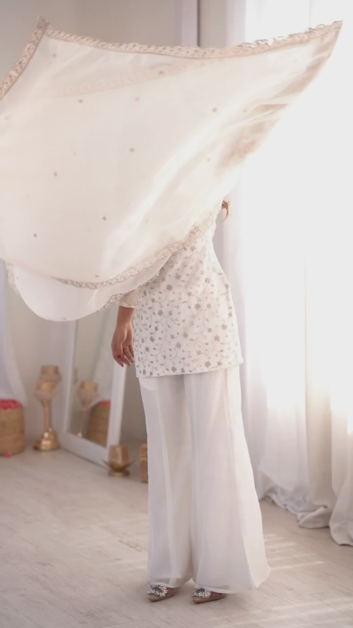 VIRAL WHITE EMBRODARY SHORT KURTI WITH BOOT CUT PLAZZO SUIT